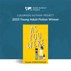 Graphic of a yellow book called AS YOU WERE with text that says "Colorado Author Project 2023 Young Adult Fiction Winner."